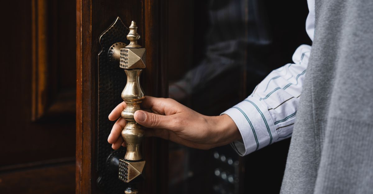 locksmith unlocking front door — Emerson Locksmith Corp